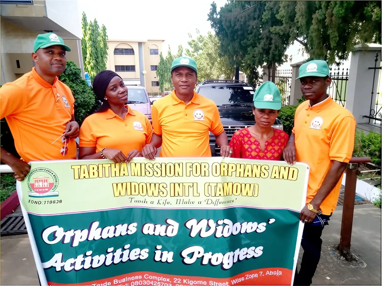 TAMOW team with mission banner